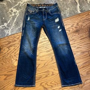 Rock Revival jean’s distressed with boot cut bottoms pictures attached